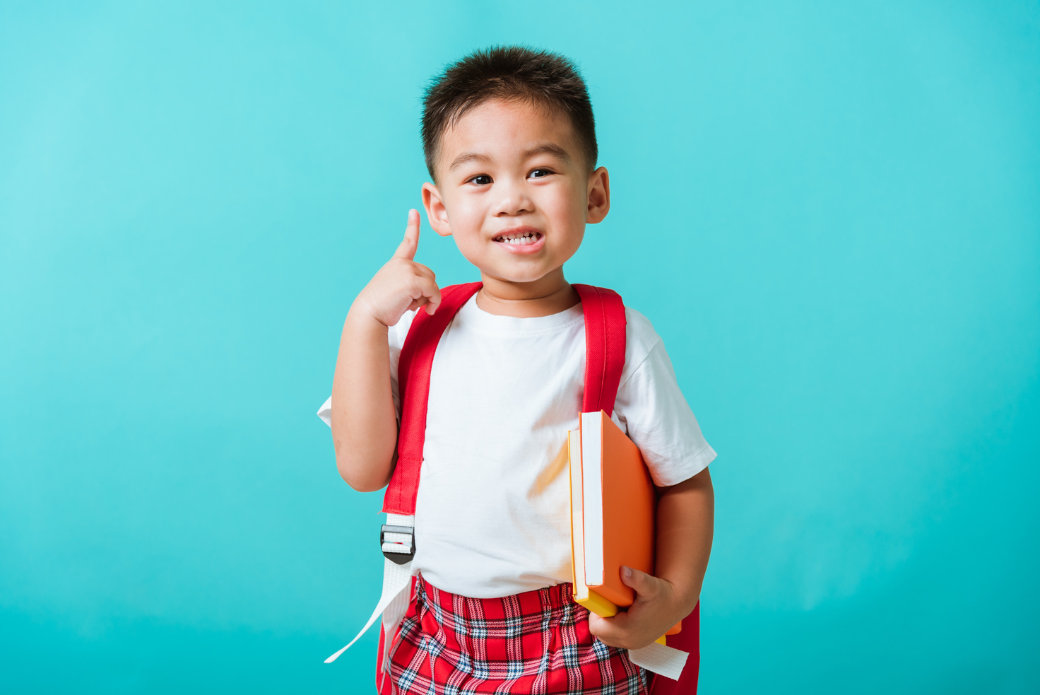 Kid from Preschool Kindergarten with Book and School Bag